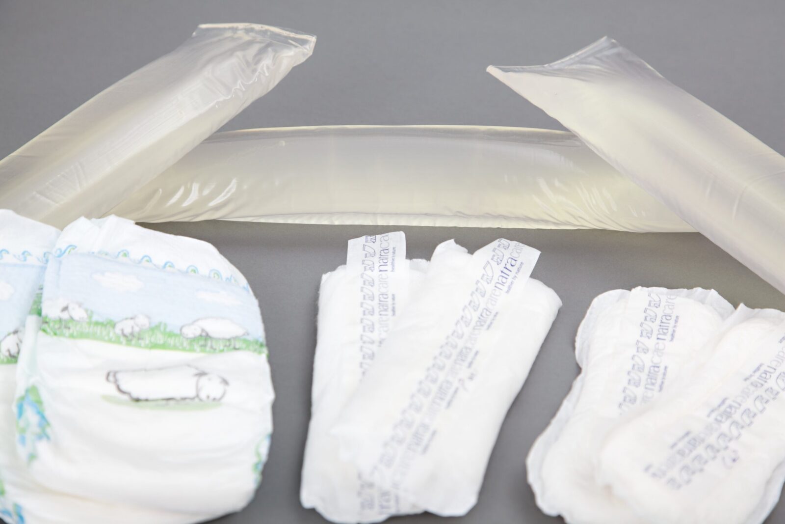 Adhesive for nappies and feminine hygiene products